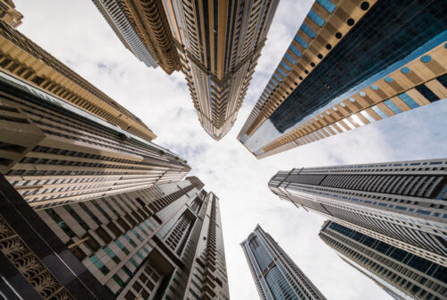 Low angle view of Dubai skyscrapers symbolizing business growth and innovation.